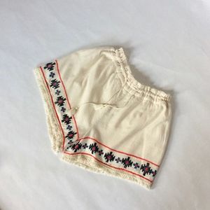 Fringe trimmed, cream cross stitch festival shorts